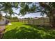 Spacious backyard featuring a well-maintained lawn and a sturdy fence, ideal for outdoor activities and privacy at 1101 39Th Ne Ave, St Petersburg, FL 33703