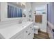 Updated bathroom with white vanity, large mirror, and modern fixtures at 1101 39Th Ne Ave, St Petersburg, FL 33703