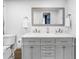 Modern bathroom featuring a double vanity, ample counter space, and a large mirror at 1101 39Th Ne Ave, St Petersburg, FL 33703