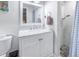 Charming bathroom with marble vanity, shower, and decorative tiles at 1101 39Th Ne Ave, St Petersburg, FL 33703