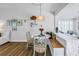 Cozy dining area featuring a round table, comfortable seating, and pendant lighting at 1101 39Th Ne Ave, St Petersburg, FL 33703