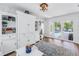 Cozy Gathering room with custom built-ins and sliding doors leading to the outdoor pool area at 1101 39Th Ne Ave, St Petersburg, FL 33703
