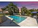 Inviting backyard pool with seating area, surrounded by lush greenery for a private and serene outdoor experience at 1101 39Th Ne Ave, St Petersburg, FL 33703