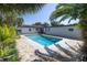 Private pool surrounded by lush landscaping and brick pavers creating a serene backyard oasis at 1101 39Th Ne Ave, St Petersburg, FL 33703