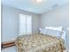 Cozy bedroom features plantation shutters and neutral tones at 12646 Carlby Cir, Tampa, FL 33626