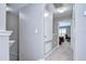 Upstairs hallway with access to the bedrooms offering a clean and well-lit walkway at 12646 Carlby Cir, Tampa, FL 33626