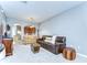 Bright living room with neutral tones, comfortable seating, and an open archway to the kitchen at 12646 Carlby Cir, Tampa, FL 33626
