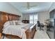 Spacious main bedroom featuring a ceiling fan, plantation shutters and desk area at 12646 Carlby Cir, Tampa, FL 33626