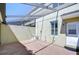 Enclosed brick patio featuring shade coverings, providing an outdoor living space at 12646 Carlby Cir, Tampa, FL 33626