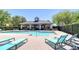 Community pool featuring a covered pavilion, lounge chairs, and beautiful landscaping for a resort-like experience at 12646 Carlby Cir, Tampa, FL 33626