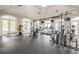 A well-equipped gym with modern exercise machines and large windows offering ample natural light at 1304 High Hammock Dr # 106, Tampa, FL 33619