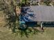 Aerial view showcasing the property, lush landscaping, mature trees, and serene surroundings at 1333 Shady Pine Way # F, Tarpon Springs, FL 34688