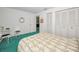 A bedroom with natural light streaming through windows, offering serene views and a cozy retreat at 1333 Shady Pine Way # F, Tarpon Springs, FL 34688