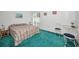 A relaxing bedroom with ample natural light and furniture that adds a cozy touch at 1333 Shady Pine Way # F, Tarpon Springs, FL 34688