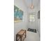 Inviting foyer with art, overhead lighting and stylish accents at 1333 Shady Pine Way # F, Tarpon Springs, FL 34688