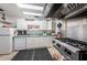 Functional kitchen equipped with appliances and plenty of cabinet space, ready for preparing meals and entertaining at 1333 Shady Pine Way # F, Tarpon Springs, FL 34688