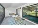 The enclosed lanai offers natural light, a peaceful retreat, and comfortable seating at 1333 Shady Pine Way # F, Tarpon Springs, FL 34688