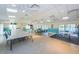 Large meeting room with ample seating, bright lighting and access to outdoor pool area with sliding glass doors at 1333 Shady Pine Way # F, Tarpon Springs, FL 34688