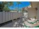 Inviting patio area with fence, plants and relaxing outdoor ambiance at 1333 Shady Pine Way # F, Tarpon Springs, FL 34688