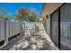 Enclosed patio with room to relax, bordered by fence and trees at 1333 Shady Pine Way # F, Tarpon Springs, FL 34688