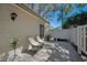 Cozy patio with chairs and a potted plant for relaxing outdoors at 1333 Shady Pine Way # F, Tarpon Springs, FL 34688