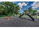 Community playground offers a slide and seesaw, perfect for outdoor Gathering fun at 1333 Shady Pine Way # F, Tarpon Springs, FL 34688
