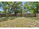 Backyard featuring a wood privacy fence and green grass at 1401 E North St, Tampa, FL 33604