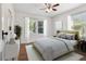 Serene bedroom with natural light, showcasing a comfortable bed and stylish decor at 1401 E North St, Tampa, FL 33604