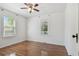 Bedroom with hardwood floors and natural light from two windows at 1401 E North St, Tampa, FL 33604