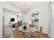 Open dining room with an elegant chandelier and glass-top table, perfect for entertaining at 1401 E North St, Tampa, FL 33604