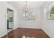 Dining room with hardwood floors, a modern chandelier, and ample natural light at 1401 E North St, Tampa, FL 33604
