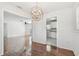 Open dining room with hardwood floors and views into the living room and kitchen at 1401 E North St, Tampa, FL 33604