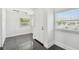 Bright entryway with black tile floor, white walls, and natural light from the windows at 1401 E North St, Tampa, FL 33604