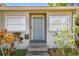 Inviting front entrance with a charming door, mailbox, and colorful foliage at 1401 E North St, Tampa, FL 33604