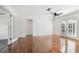 Large living room with hardwood floors, ceiling fan, and lots of natural light at 1401 E North St, Tampa, FL 33604