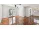 Open living room with hardwood floors, ceiling fan, and natural light from the french doors at 1401 E North St, Tampa, FL 33604