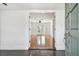 Open entryway reveals a spacious living room with hardwood floors and French doors at 1401 E North St, Tampa, FL 33604
