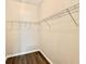 Walk-in closet with shelving, and wood-look flooring at 17114 Carrington Park Dr # 207, Tampa, FL 33647