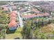Wide angle aerial view of the condo complex with multiple parking lots and tennis courts at 18001 Richmond Place Dr # 1032, Tampa, FL 33647