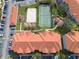 Aerial view of condo complex with pool, playground, tennis court, and sand volleyball at 18001 Richmond Place Dr # 1032, Tampa, FL 33647