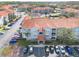 Aerial view of the condo complex with well-maintained parking and manicured landscaping at 18001 Richmond Place Dr # 1032, Tampa, FL 33647