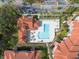 Aerial of the condo complex with an L-shaped pool and poolside seating at 18001 Richmond Place Dr # 1032, Tampa, FL 33647