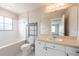Bathroom features a tub, mirror, and vanity with storage at 18001 Richmond Place Dr # 1032, Tampa, FL 33647