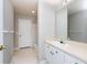 Bathroom showing a large mirror, vanity, and tiled floors at 18001 Richmond Place Dr # 1032, Tampa, FL 33647