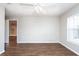 Bright bedroom with hardwood floors and window allowing ample natural light at 18001 Richmond Place Dr # 1032, Tampa, FL 33647