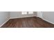 Bedroom with hardwood floors, white trim and baseboards at 18001 Richmond Place Dr # 1032, Tampa, FL 33647