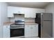 Cozy kitchen with stainless steel appliances and ample cabinet space at 18001 Richmond Place Dr # 1032, Tampa, FL 33647