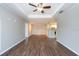 Open-concept living area with a view into the kitchen, highlighting the modern hardwood floors at 18001 Richmond Place Dr # 1032, Tampa, FL 33647