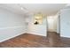 Spacious living room with modern hardwood floors, a dining area, and open layout to the kitchen at 18001 Richmond Place Dr # 1032, Tampa, FL 33647