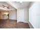 Open living room area with hardwood floors adjacent to the kitchen and bright window at 18001 Richmond Place Dr # 1032, Tampa, FL 33647
